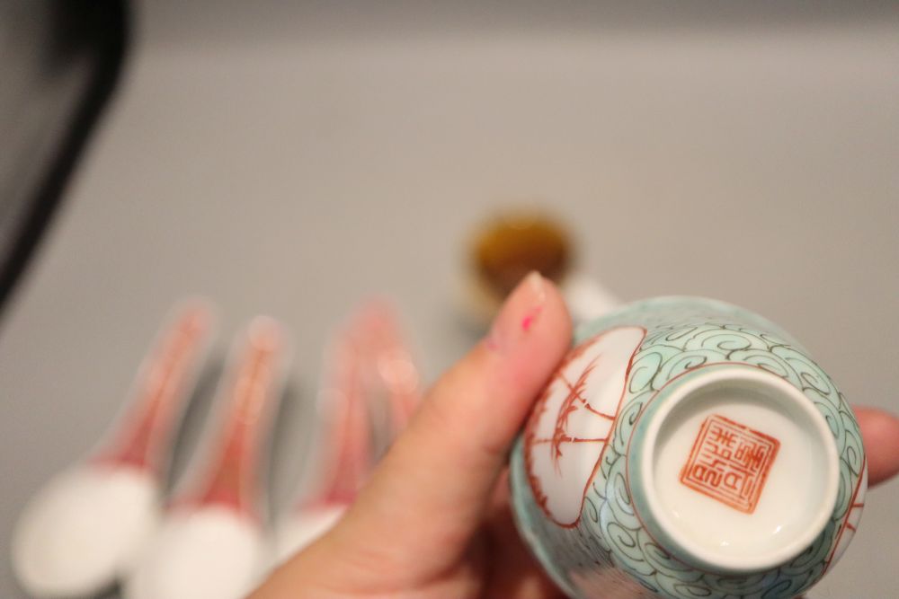 A collection of tea bowls and spoons